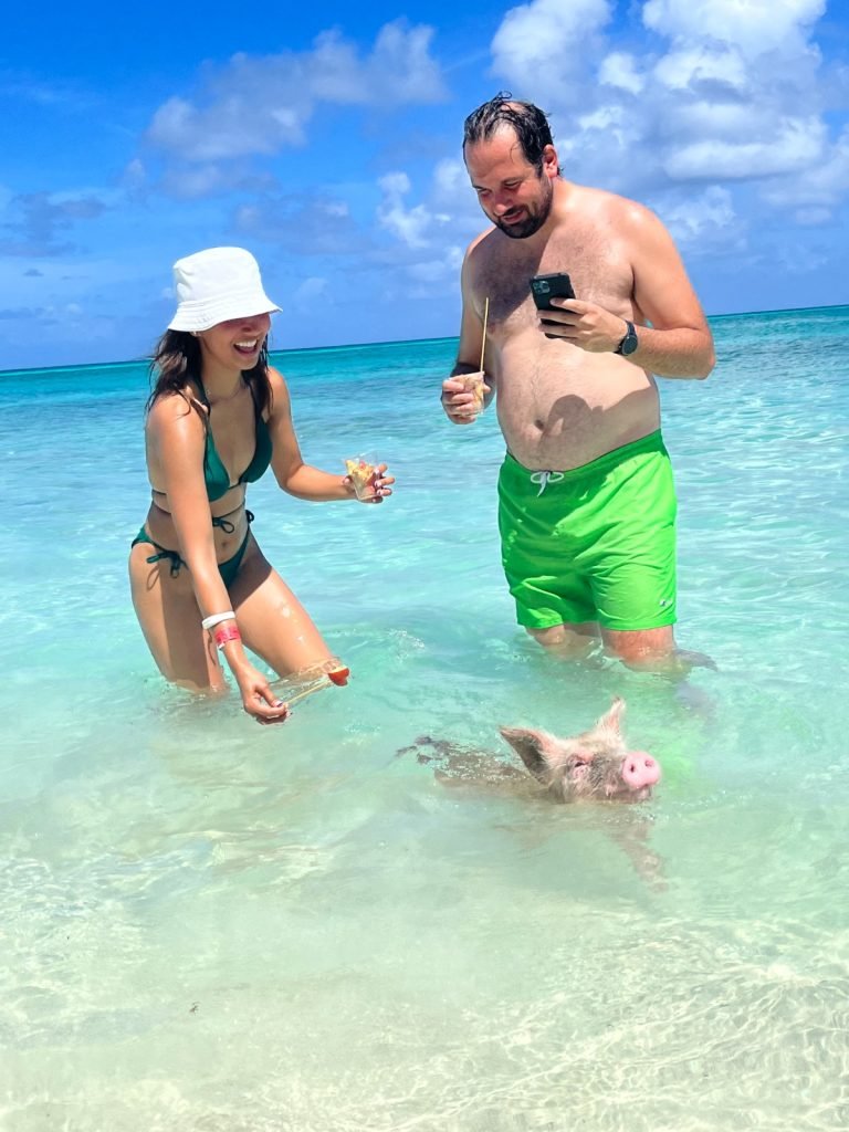 Rose Island Swimming Pigs with a men and women