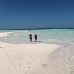 People enjoying the beautiful Nassau Beach in the Bahamas